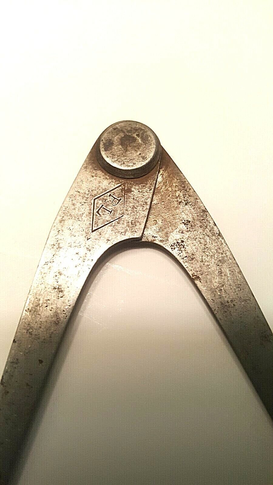 P Lowentraut 4" Inside Firm Joint Caliper, w/"P.L." inside a Horiz. Diamond Logo